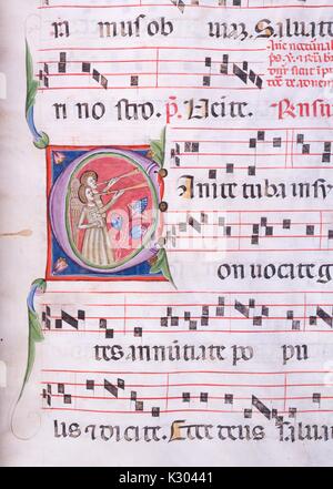 Illuminated manuscript page containing illustrated sheet music with two angels blowing into horns, from a 15th century Latin manuscript book, 1450. Stock Photo