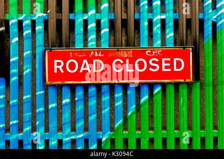 Road closed sign. Security iron gate separating Catholic and Protestant communities, at Belfast peace wall. Northern Ireland, United Kingdom, UK