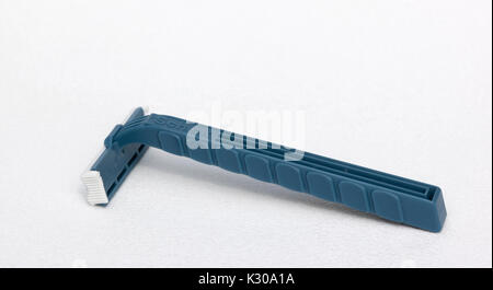 A blue Schick disposable razor made from the plastic, polypropylene. Stock Photo