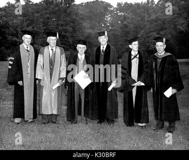 Group portrait of Johns Hopkins University President and honorary degree recipients in academic dress following the University's class of 1951 commencement ceremony (left to right): Chairman of the Mechanical Engineering Department Alexander Graham Christie, physics professor Robert Williams Wood, philosophy and professor Arthur Oncken Lovejoy, scholar and English literature professor Raymond Dexter Havens, electrical engineer and professor John Boswell Whitehead, and Johns Hopkins University President Detlev Wulf Bronk, June 12, 1951. Stock Photo