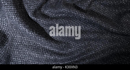 waving cotton gray fabric, textile background. Stock Photo