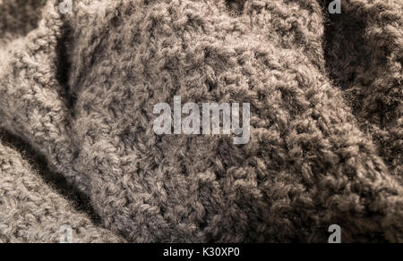 Knitted beige cashmere wool fabric, textile background. Stock Photo