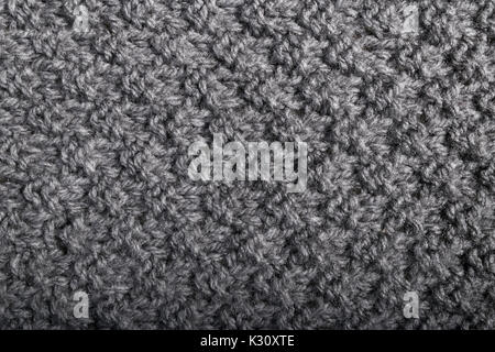 rough hand made knitted gray cashmere fabric. Stock Photo