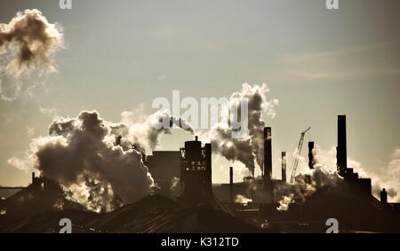 Steel-mill plant scenery line with fuming chimney-stalks in Hamilton Ontario Stock Photo