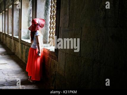 Chinese tourist inside a temple at Angkor Wat, Cambodia Stock Photo