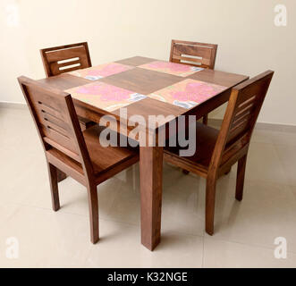 Natural  Wooden Dining Table with Four Chairs Stock Photo