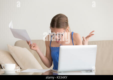 Woman tired and angry because of hard paperwork Stock Photo