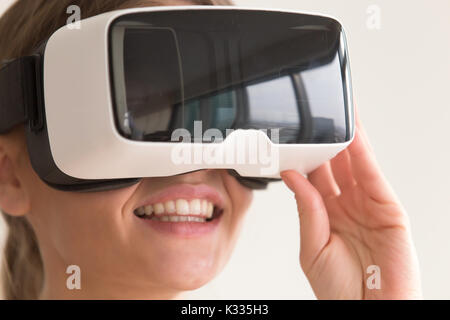 Portrait of woman using virtual reality glasses Stock Photo