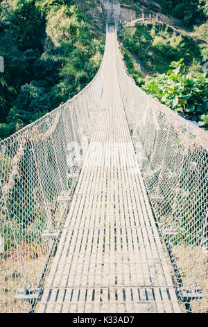 The Chomrong suspended bridge, on the Annapurna Base Camp Trek, Nepal Stock Photo