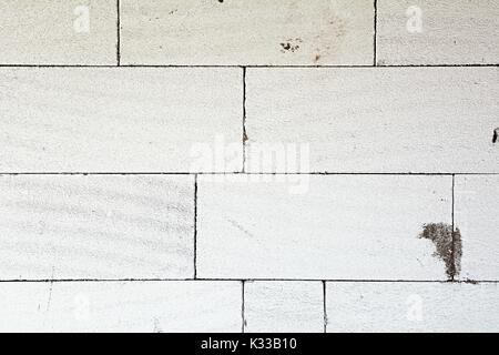 Texture of a wall made from white aerated concrete blocks. Stock Photo