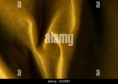 Golden angora goat velours fabric resembling velvet, mixed with natural silk threads. mohair textile. cashmere, velvet suede and chamois effect. for u Stock Photo