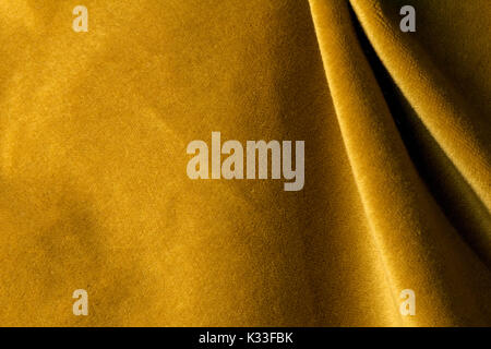 Golden angora goat velours fabric resembling velvet, mixed with natural silk threads. mohair textile. cashmere, velvet suede and chamois effect. for u Stock Photo