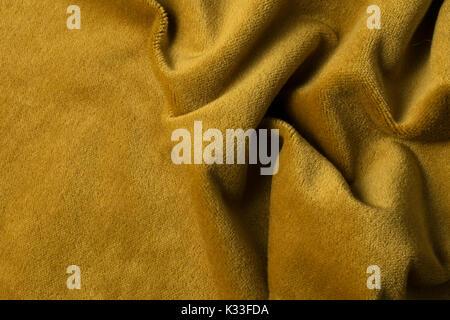 Golden angora goat velours fabric resembling velvet, mixed with natural silk threads. mohair textile. cashmere, velvet suede and chamois effect. for u Stock Photo