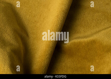 Golden angora goat velours fabric resembling velvet, mixed with natural silk threads. mohair textile. cashmere, velvet suede and chamois effect. for u Stock Photo
