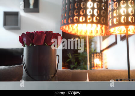 Roses in black box standing on the white table Stock Photo