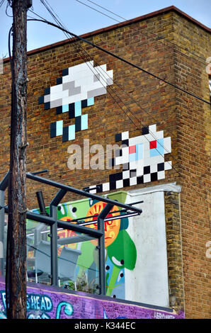 London, England, UK. Mosaic Street art by 'Invader' (French urban artist, b1969) in Camden Town Stock Photo