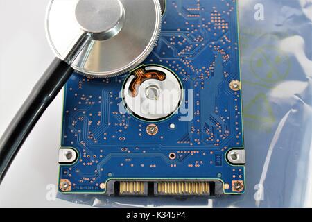 An concept image of a hard drive, disk and a stethoscope Stock Photo