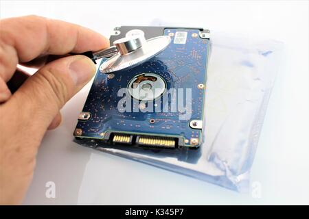 An concept image of a hard drive, disk and a stethoscope Stock Photo