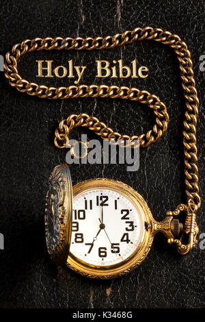 Pocket Watch On Holy Bible Stock Photo