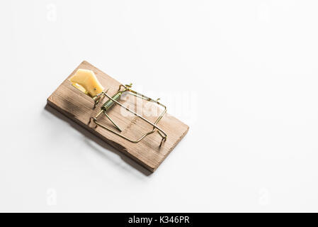 Mouse trap with cheese isolated on white Stock Photo