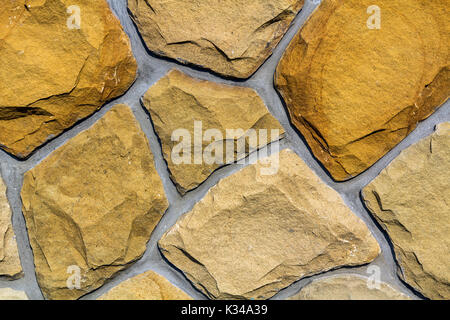 Wall made of natural limestone. Irregular stones surface. Seamlessr old stone texture background Stock Photo