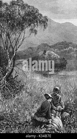 1870:A couple sitting at the edge of Loch Katrine, in the background is  Ellen’s Isle which plays an important role in Sir Walter Scott’s ‘The Lady of the Lake’. Loch Katrine, a freshwater loch and scenic attraction in the Trossachs area of the Scottish Highlands. It is now owned by Scottish Water, and has been the primary water reservoir for much of the city of Glasgow and its surrounding areas since 1859, Stirling, Scotland Stock Photo