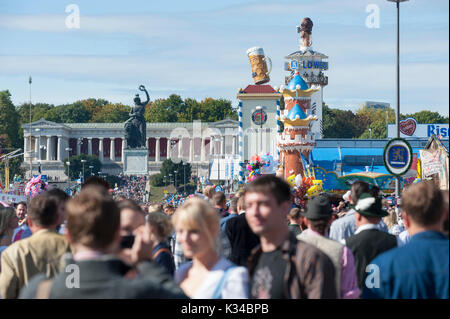 Oktoberfest in Munich is the biggest beer and folk festival in the world.with many thousands visitors every day, now walking over funfair Stock Photo
