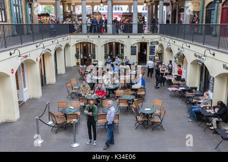 LONDON, ENGLAND - JUNE 08, 2017: Covent Garden market in London. This tourist attraction in London is famous about its restaurants, pubs, market stall Stock Photo