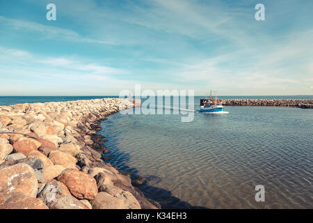 Fishing boat in the harbor of the little danish village Aalbæk near Skagen in the Area of Kattegat Stock Photo