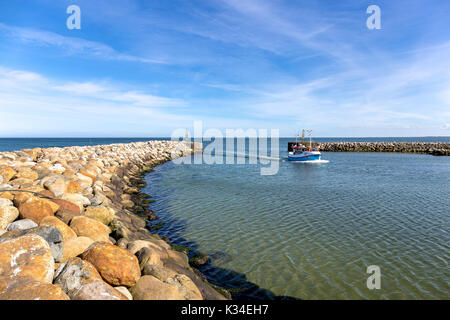 Fishing boat in the harbor of the little danish village Aalbæk near Skagen in the Area of Kattegat Stock Photo