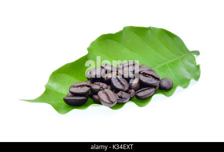 coffee beans and coffee leaf on white background. Stock Photo