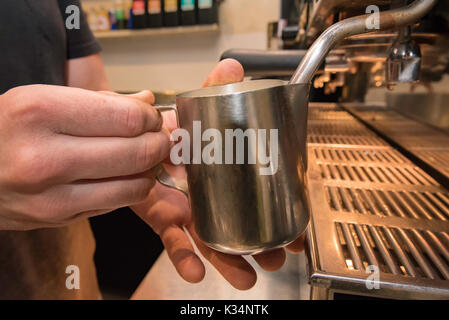A Barista making coffee in a coffee shop in Sydney Stock Photo