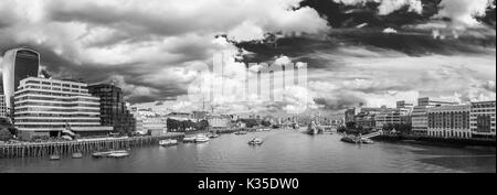 Panoramic cityscape view from London Bridge along the River Thames towards Tower Bridge and HMS Belfast and the City of London financial district, UK Stock Photo