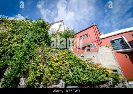 Dramatic view looking up at cliffside houses in Positano, Italy on the Amalfi Coast. Stock Photo