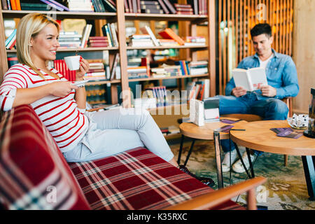 Beautiful woman relaxing after studying Stock Photo