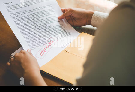 Women are opening an envelope document about signing a contract in business and sign contract concept,vintage style Stock Photo