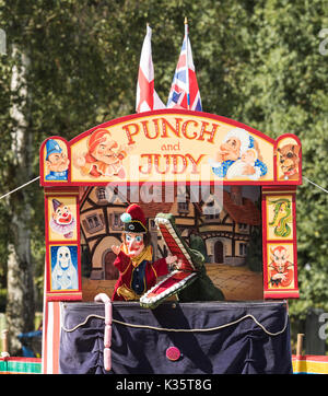 a traditional Punch and Judy show by David Wilde in an English park in the summer at Brentwood, Essex with the Mr Punch, Crocodile and sausages+ Stock Photo