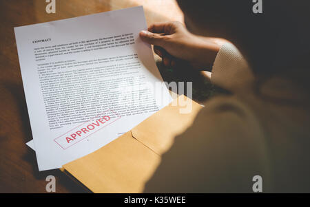 Women are opening an envelope document about signing a contract in business and sign contract concept,vintage style Stock Photo