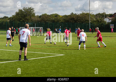 Heywood, Greater Manchester, UK. 1st Sep, 2017. Today saw the kick-off of the second season for the Greater Manchester Over 60s Walking Football league at Heywood Sports Village. Bury Relics in red beat Bolton Wanderers B 2-1 in their opening game. Walking Football is one of the fastest growing areas of organised football in the UK, aimed at increasing health and fitness through physical activity in the over 50s, encouraged by football clubs, health professionals and the Football Association. Credit: Joseph Clemson/Alamy Live News Stock Photo