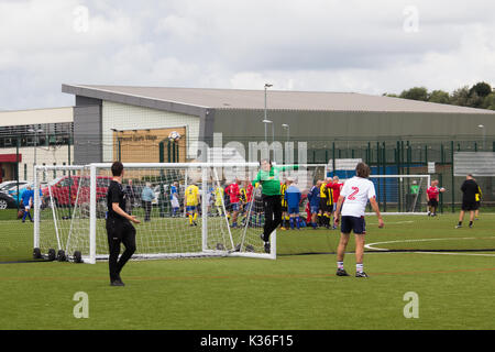 Heywood, Greater Manchester, UK. 1st September 2017. Today saw the kick-off of the second season for the Greater Manchester Over 60s Walking Football league at Heywood Sports Village. An agile Bolton Wanderers A team goalie watches a shot safely over the bar while playing out a goalless draw in their match with Fleetwood Town Flyers. Walking Football is one of the fastest growing areas of organised football in the UK, aimed at increasing health and fitness through physical activity in the over 50s, encouraged by football clubs, health professionals and the Football Association. Stock Photo