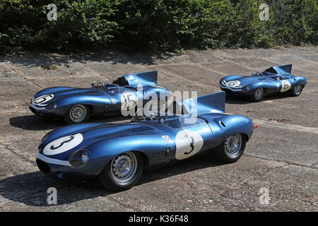 Five historic D-Type Jaguars visit Brooklands circuit, Weybridge, Surrey, England, UK. 1st September 2017. D-Type Jaguars won the Le Mans 24hr endurance race in 1955, 1956 and 1957. In 1957, D-Types were placed 1-2-3-4-6, with only a solitary Ferrari in 5th spoiling the parade. In picture, shown on Members' Banking, car numbered '3' (Ecurie Ecosse, XKD 606) is the 1957 Le Mans winner and car '15' (Ecurie Ecosse, XKD 603) came second. Car '6' (Ecurie Ecosse, XKD 504) was the first long-nose D-Type built. Stock Photo