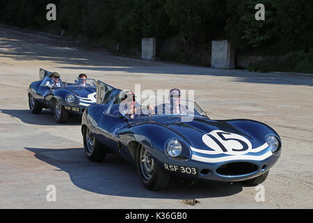 Five historic D-Type Jaguars visit Brooklands circuit, Weybridge, Surrey, England, UK. 1st September 2017. D-Type Jaguars won the Le Mans 24hr endurance race in 1955, 1956 and 1957. In 1957, D-Types were placed 1-2-3-4-6, with only a solitary Ferrari in 5th spoiling the parade. In picture, shown on Finishing Straight, car numbered '15' (Ecurie Ecosse, XKD 603, 'long-nose') came second at Le Mans in 1957. Car '6' (Ecurie Ecosse, XKD 504, 'long-nose') was the first long-nose D-Type built. Stock Photo