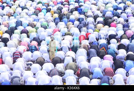 Dimapur, India September 02, 2017: An Indian Muslim kid looks on as elders offer prayers during the Eid-al-Adha prayer in Dimapur, India north eastern state of Nagaland. Muslims across the world celebrate the annual festival of Eid al-Adha, or the Festival of Sacrifice, which marks the end of the Hajj pilgrimage to Mecca and commemorates Prophet Abraham's readiness to sacrifice his son to show obedience to God. Credit: Caisii Mao/Alamy Live News Stock Photo