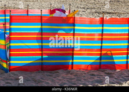 Bournemouth, Dorset, UK. 2nd Sep, 2017. UK weather: lovely warm sunny day at Bournemouth beach as visitors get there early to get a good spot on the third day of the Bournemouth Air Festival. Inflatable unicorn hiding behind windbreak. Credit: Carolyn Jenkins/Alamy Live News Stock Photo