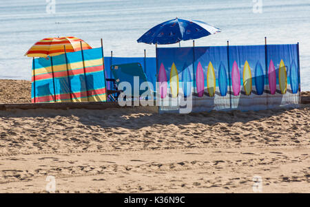 Bournemouth, Dorset, UK. 2nd Sep, 2017. UK weather: lovely warm sunny day at Bournemouth beach as visitors get there early to get a good spot on the third day of the Bournemouth Air Festival. Windbreak and parasols. Credit: Carolyn Jenkins/Alamy Live News Stock Photo