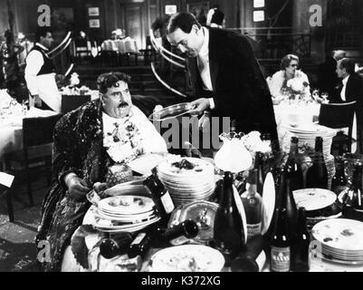 MONTY PYTHON'S THE MEANING OF LIFE TERRY JONES AND JOHN CLEESE  A PYTHON PICTURE Stock Photo