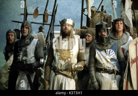 MONTY PYTHON AND THE HOLY GRAIL FROM LEFT, ERIC IDLE, JOHN CLEESE, GRAHAM CHAPMAN     Date: 1975 Stock Photo