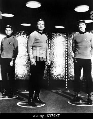 STAR TREK DEFOREST KELLY as Dr McCoy aka Bones, WILLIAM SHATNER as Captain James T Kirk, LEONARD NIMOY as Mr Spock STAR TREK Stock Photo