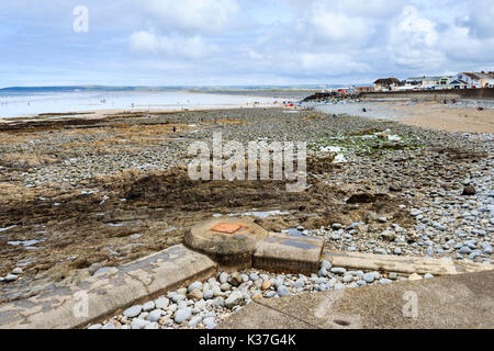 Victorian pipe on rocky beach at Westward Ho!, Devon, England, UK Stock Photo