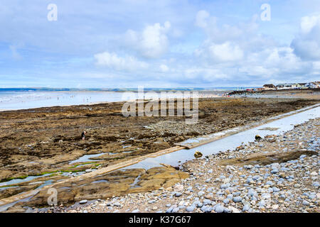 Victorian pipe on rocky beach at Westward Ho, Devon, England, UK Stock Photo